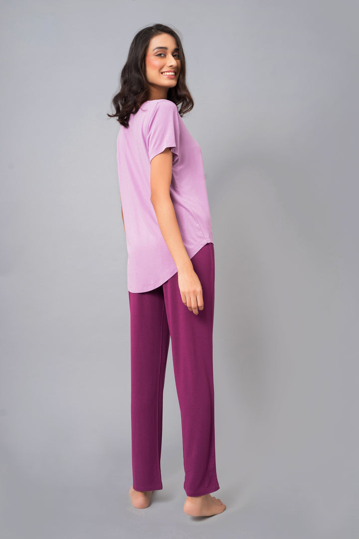 Woman in Wineberry Straight Lounge Set, relaxed pose, stylish comfort wear.