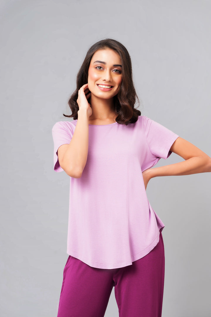 Wineberry Straight Lounge Set on model, featuring stylish lavender top and pants.