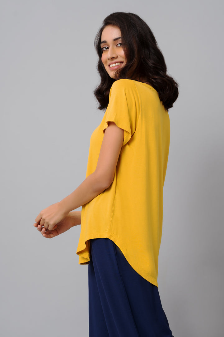 Stylish Buttercup Yellow Top on a smiling model, perfect for casual wear.