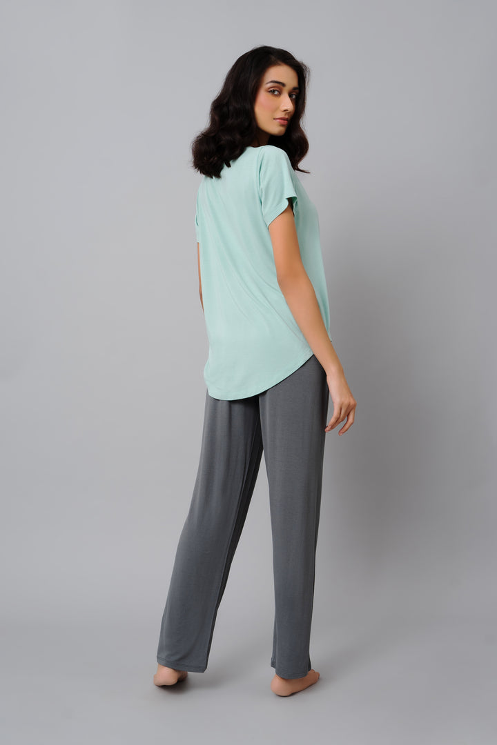 Woman wearing Grey Pearl Straight Lounge Pant with a mint top.