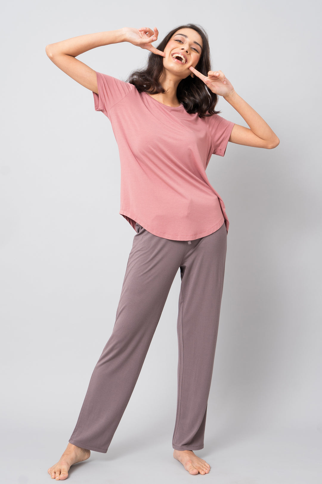 Model wearing Sweet Oak Straight Lounge Pant with a playful pose.