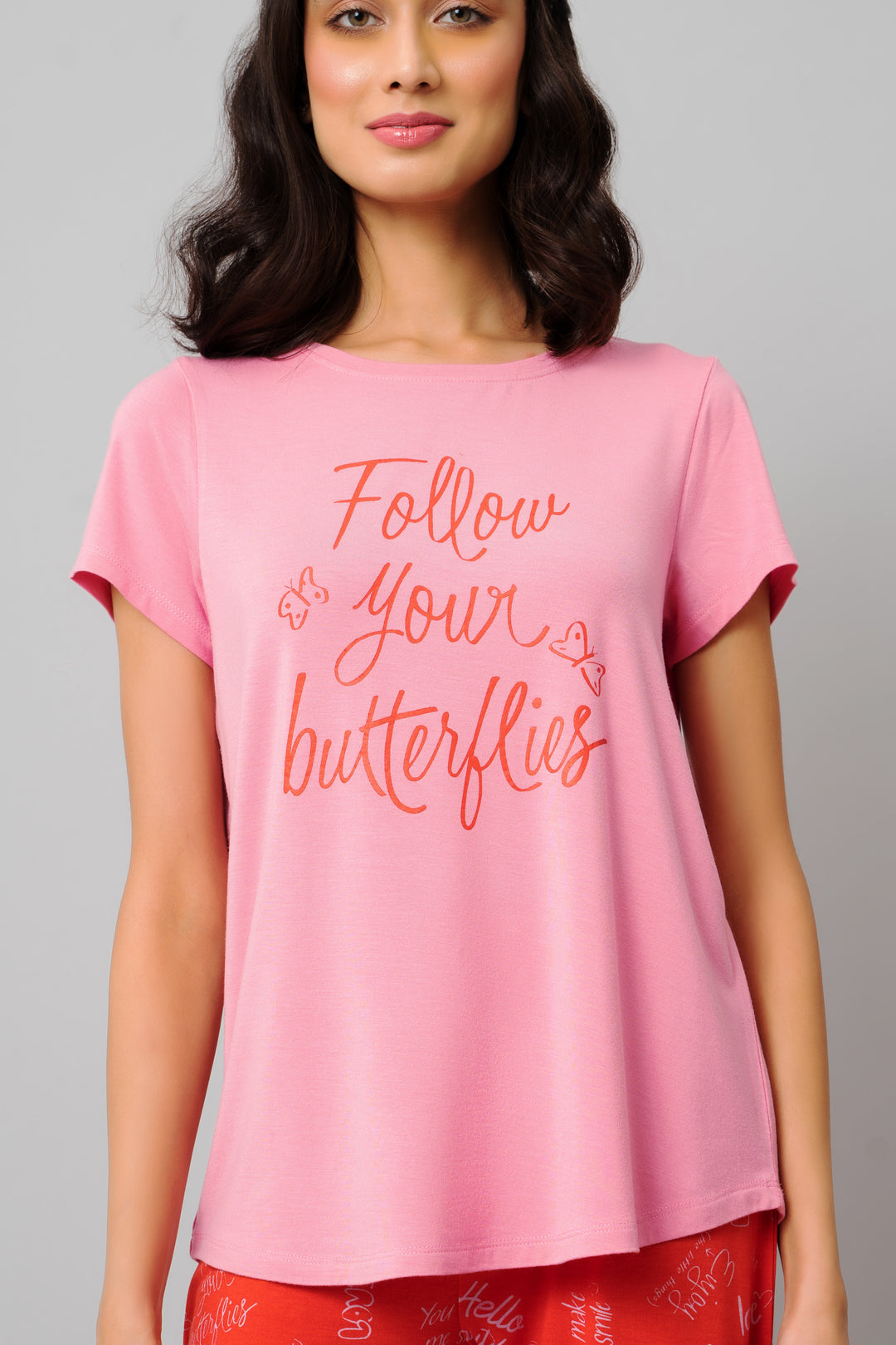 Pink top with "Follow Your Butterflies" text design for women.