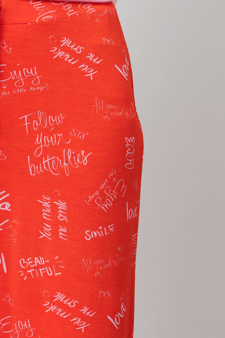 Red "Love Escape Shorts" featuring playful handwritten quotes and butterflies.