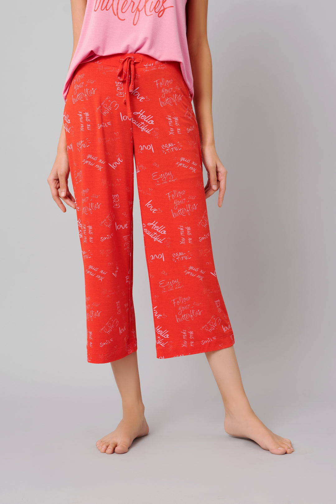 "Follow Your Butterflies Capri Set in vibrant red with inspiring text"