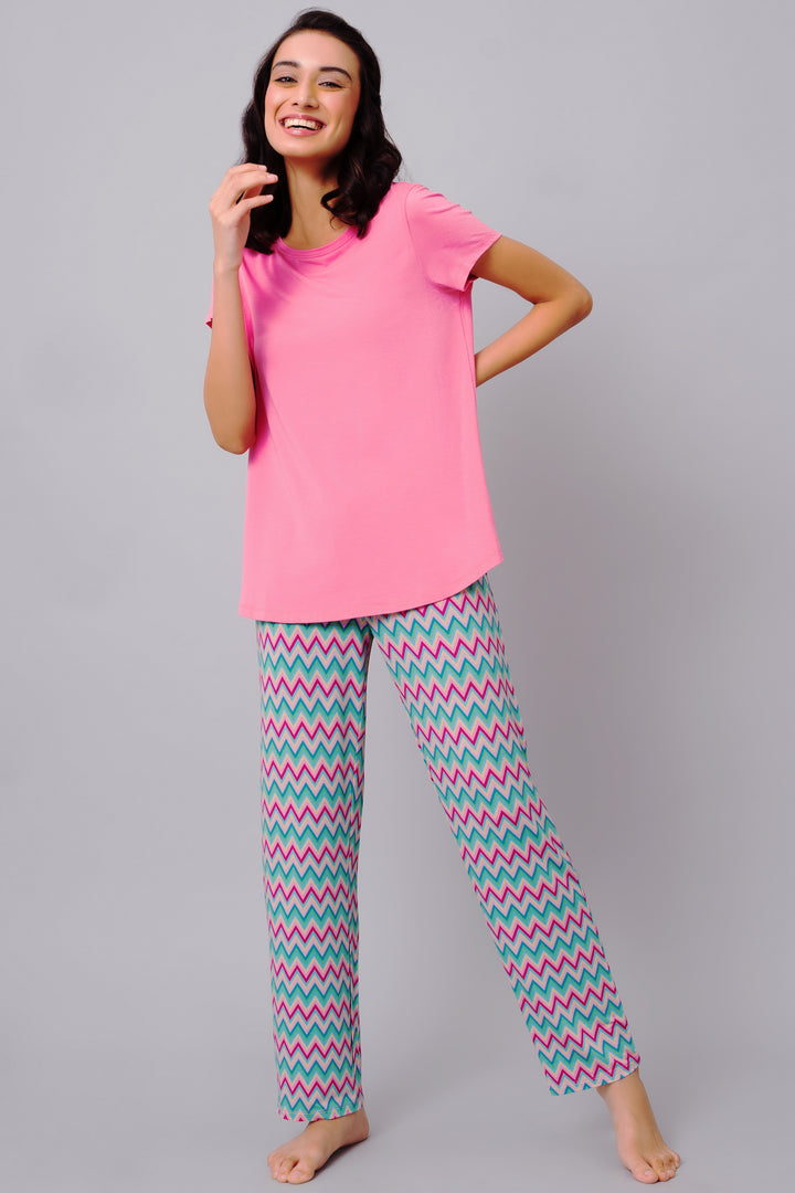 Mellow Pink Top paired with colorful zigzag pajama pants.