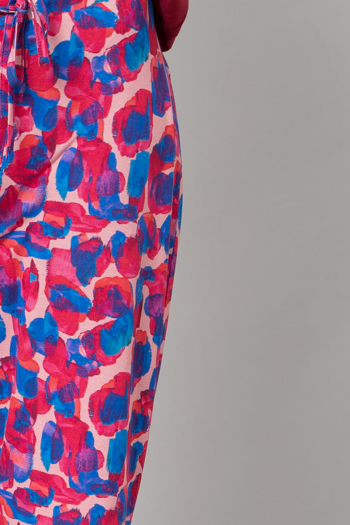 Artsy watercolor pajama set featuring vibrant pink and blue patterns.