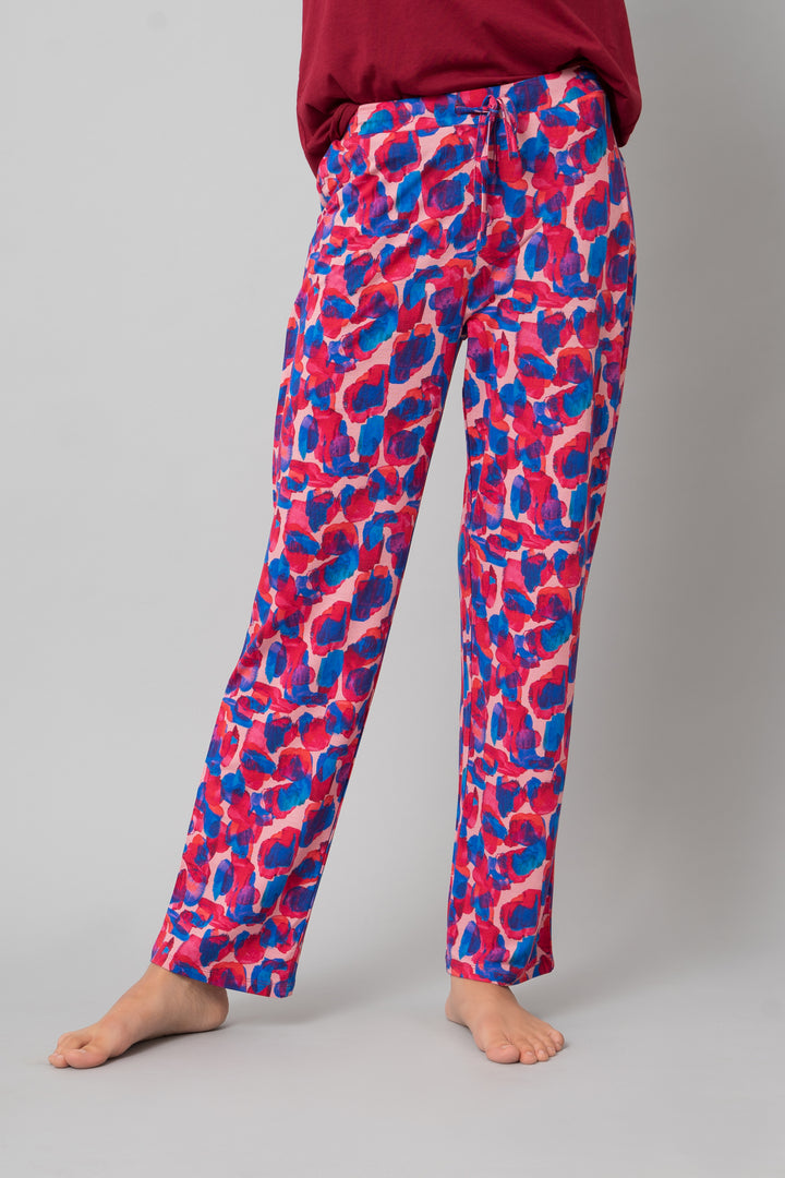 Artsy watercolor pajama set featuring vibrant pink and blue patterns.