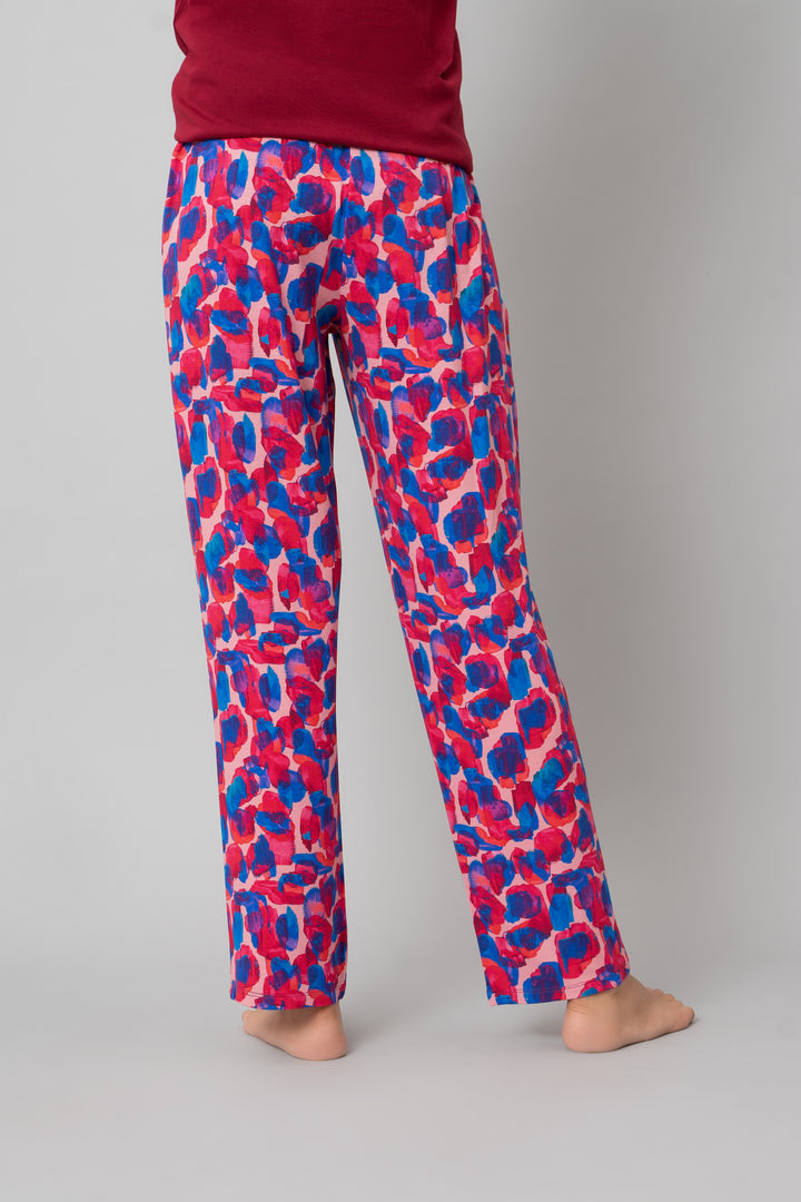 Artsy watercolor pajama set featuring vibrant pink and blue patterns.