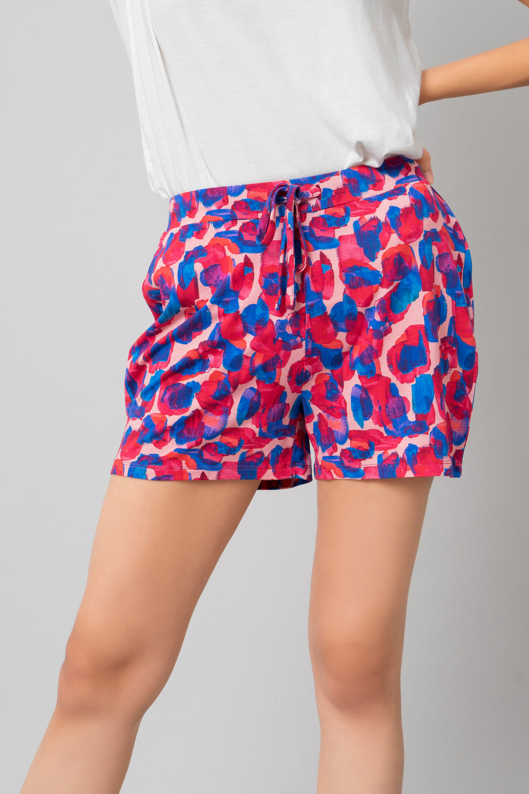 Artsy watercolor shorts set featuring vibrant pink and blue patterns.