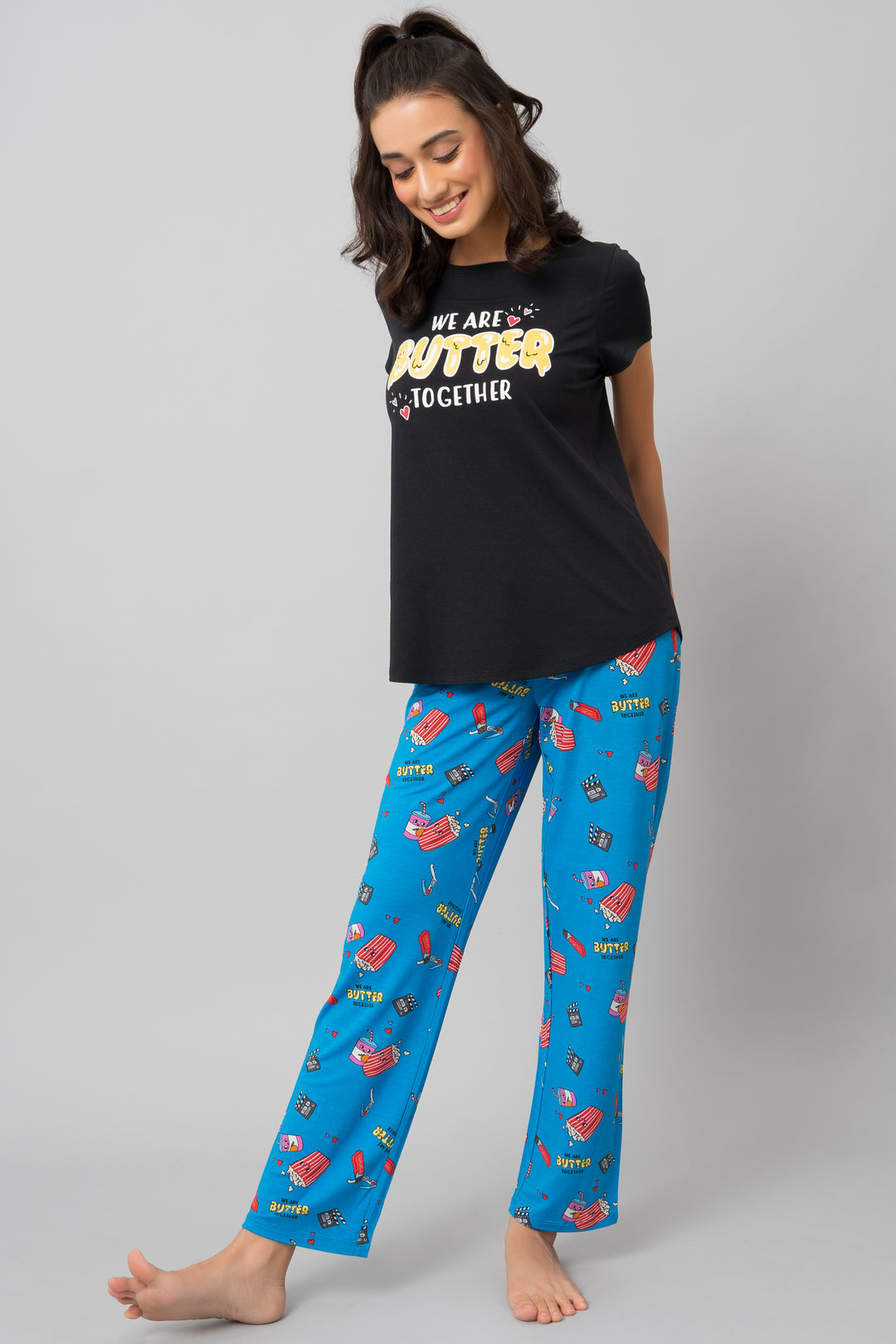 "Model wearing Butter Together Pajama Set with playful print and message."