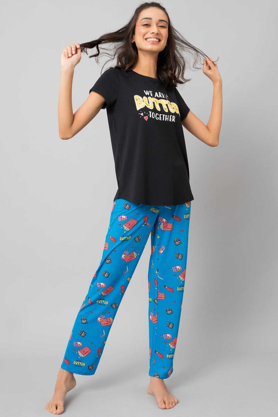 Butter Together Pajama Set with black shirt and colorful patterned pants.