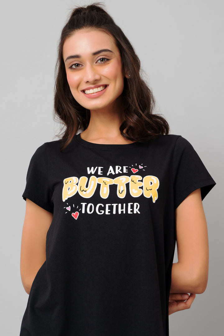 Woman wearing black shirt with "We Are Butter Together" graphic design.