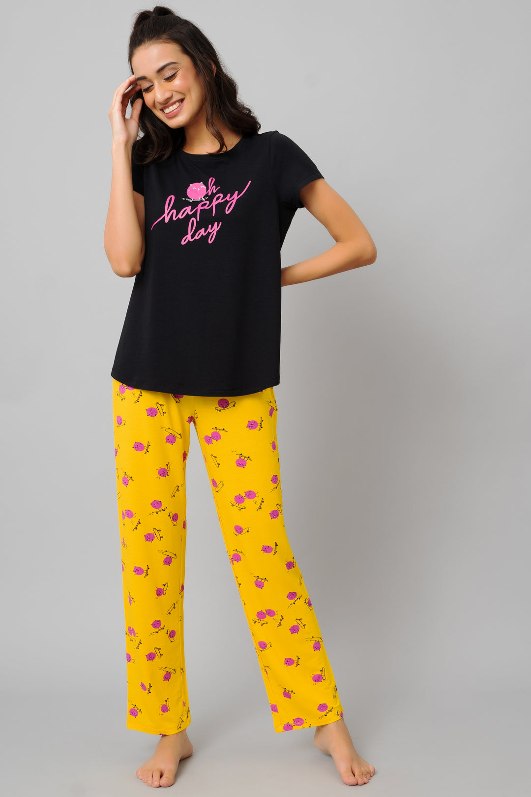 Oh Happy Day Pajama Set with black top and yellow floral pants.