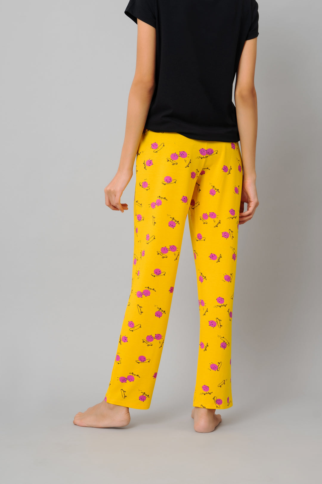 Fuffy Kitty Pajama Set in yellow with colorful floral patterns.