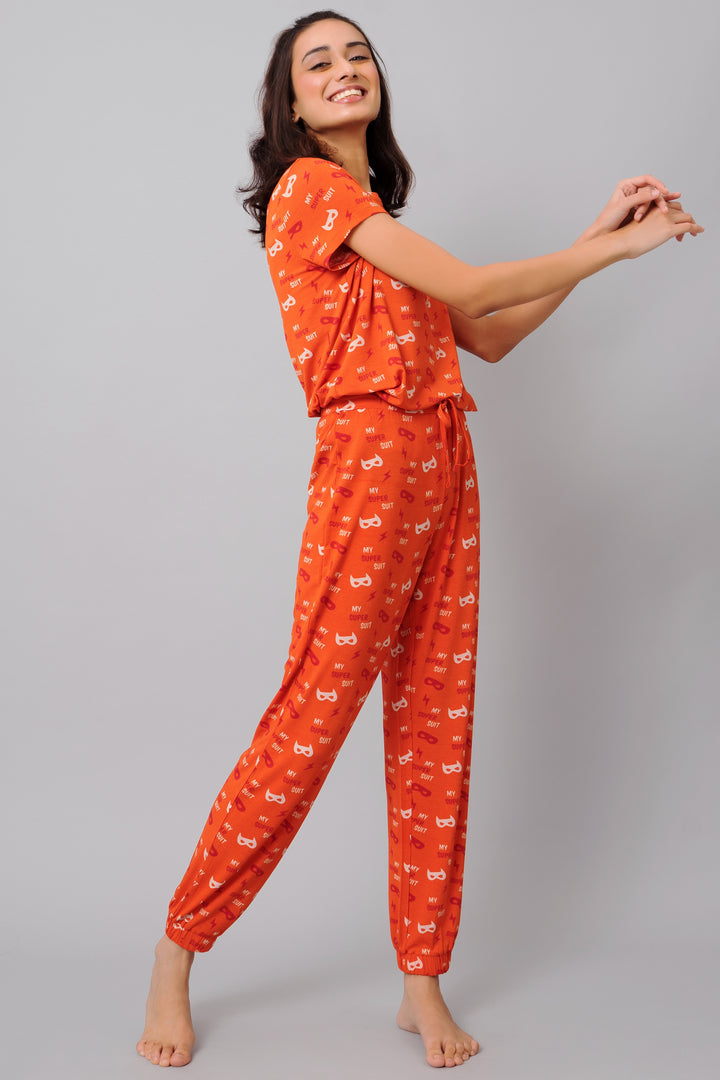 Bright orange Super Suit pajama set for kids featuring playful graphics.