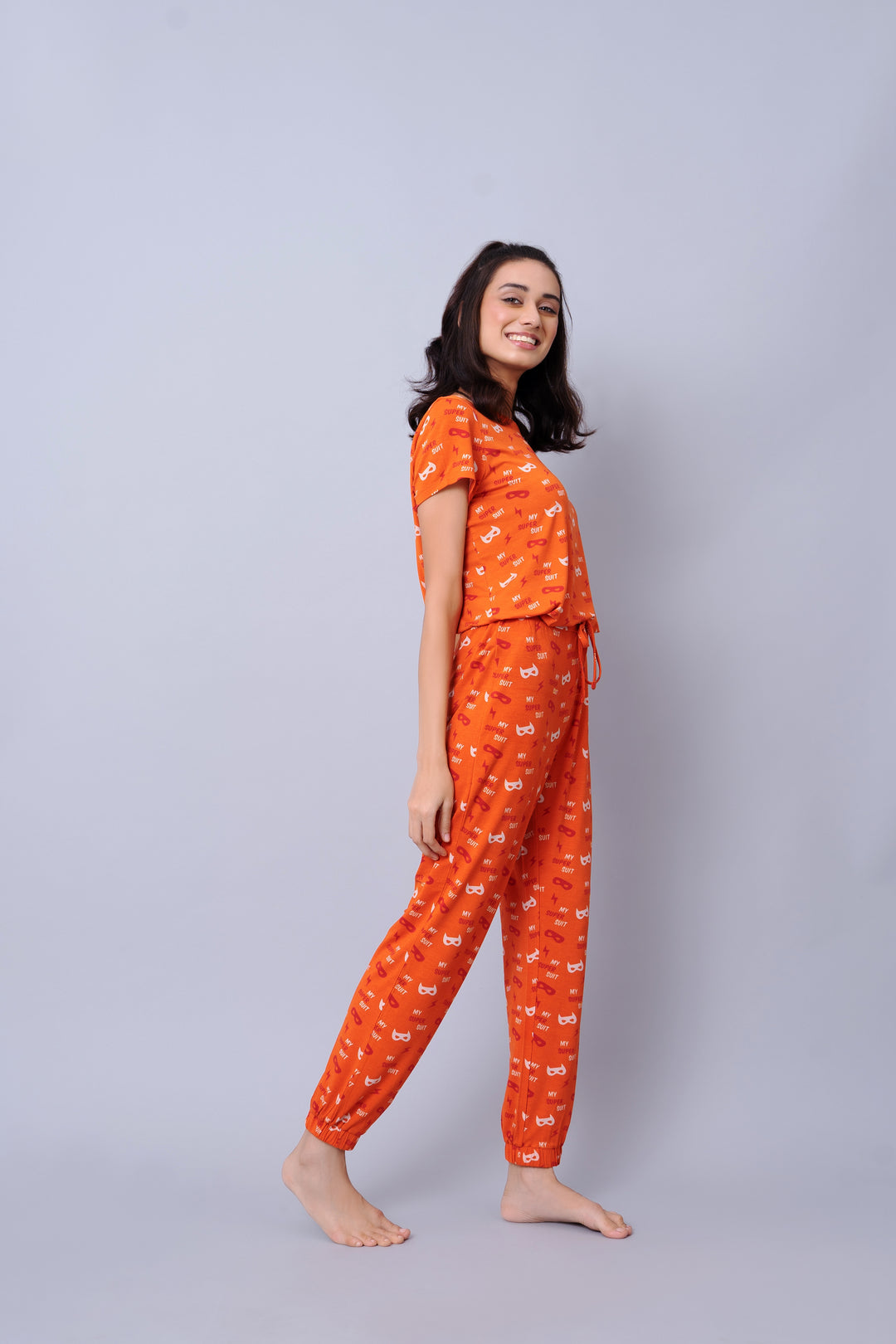 Bright orange Super Suit Pajama Set for comfortable lounging.