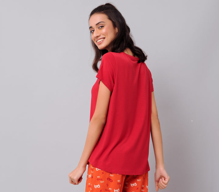 Smiling model showcasing the red Frenzy Bolt Pajama Set.