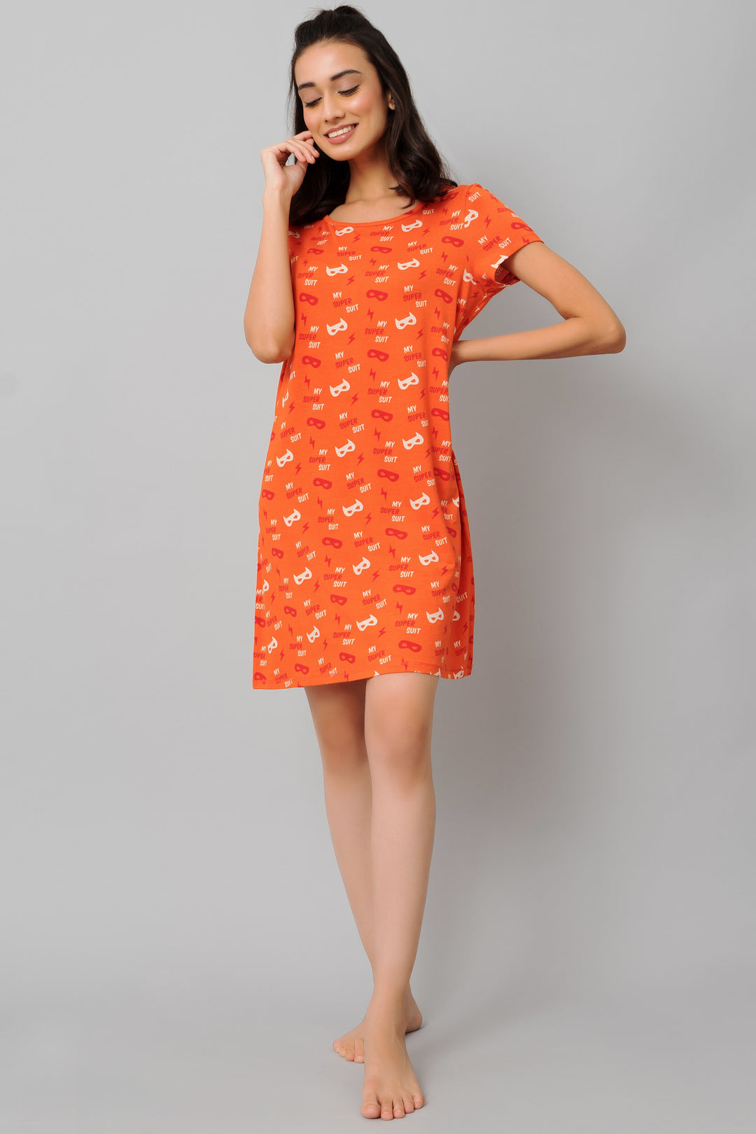 Bright orange short dress with playful patterns for casual style.