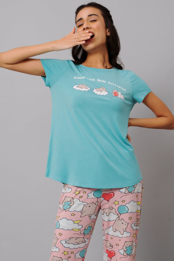 Hibernation Mode Capri Set with playful cloud and animal prints.