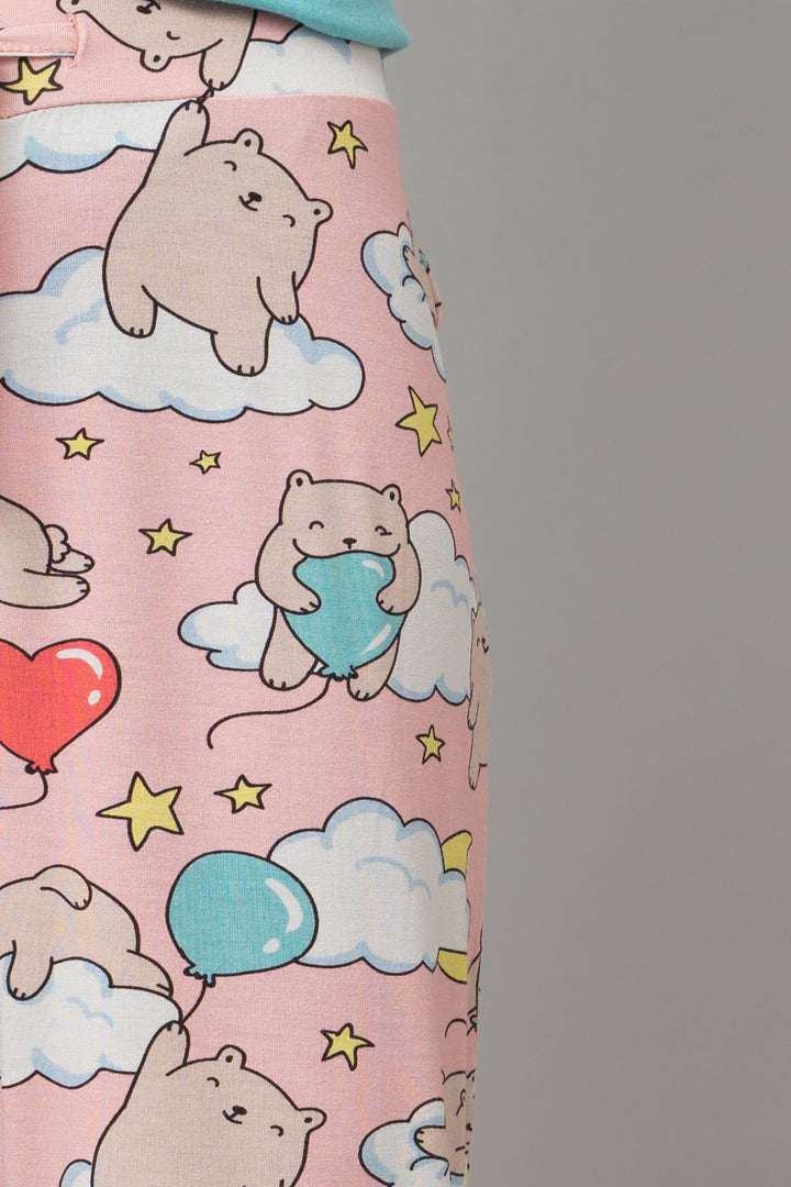 Cute capri pants featuring playful bears and colorful clouds.