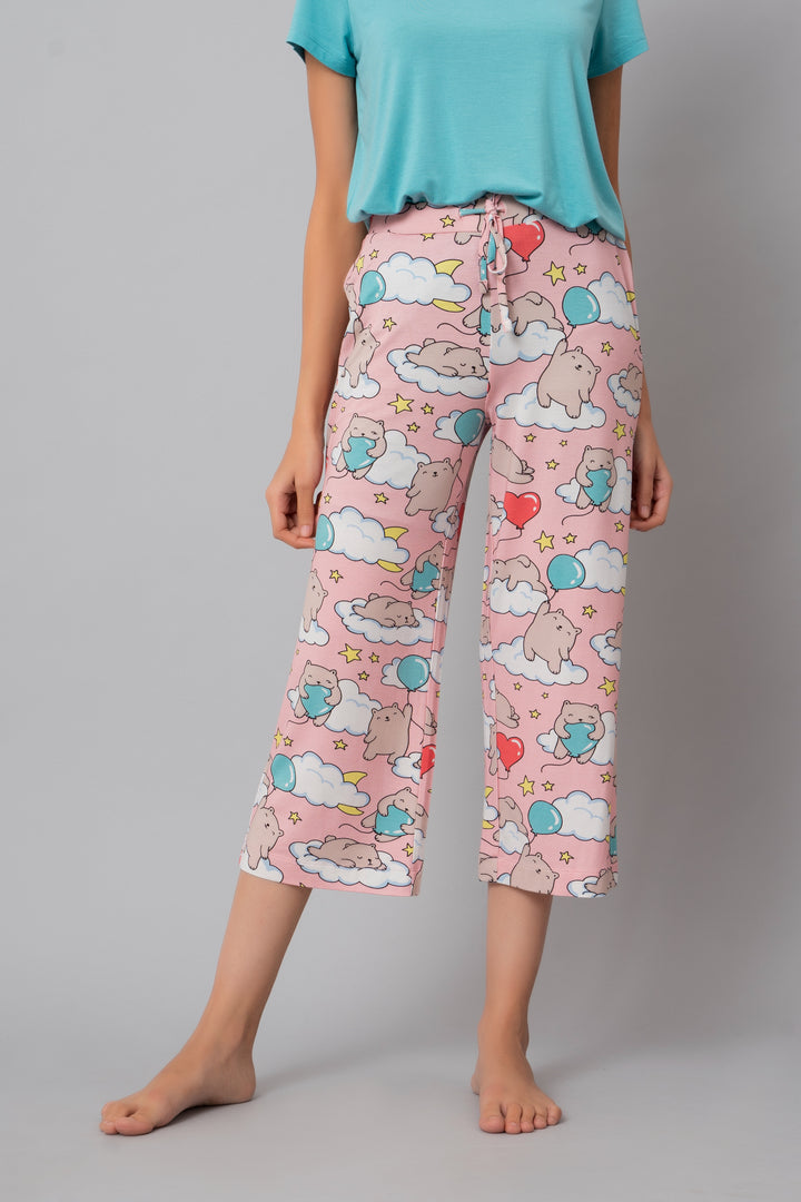 Colorful Capri pants featuring playful bear and cloud patterns.