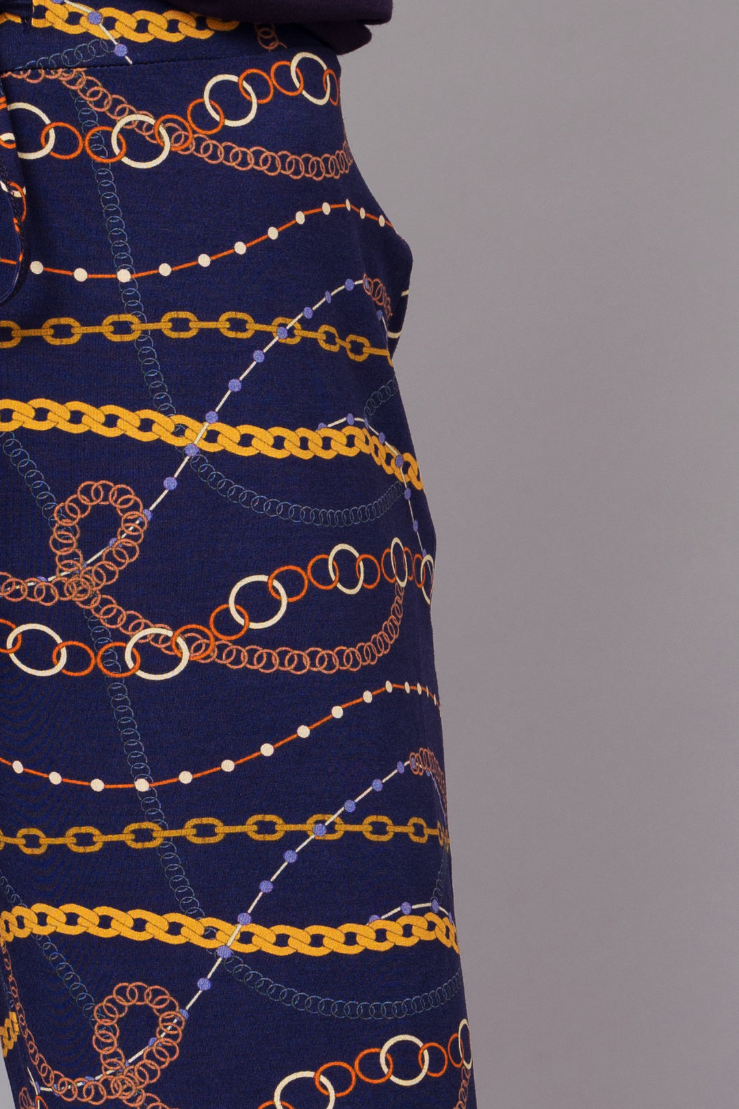 Linked Chains Capri Set featuring vibrant chain patterns on navy fabric.