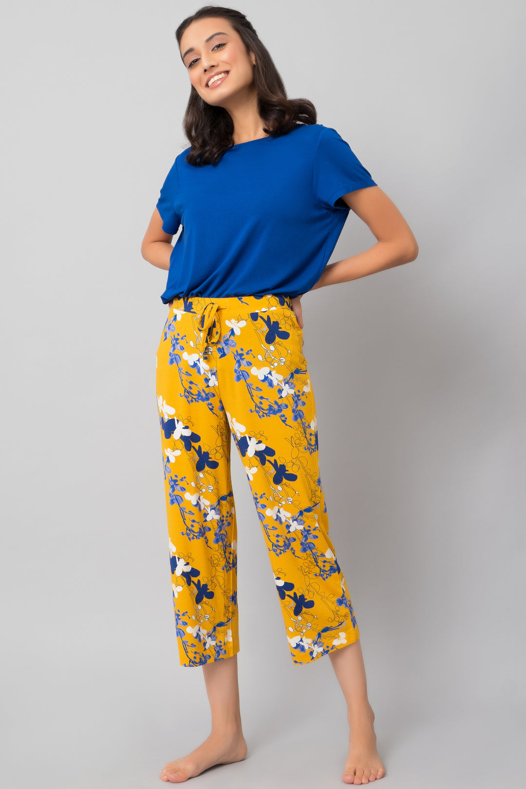 Floral Love Capri Set featuring a blue top and vibrant floral pants.