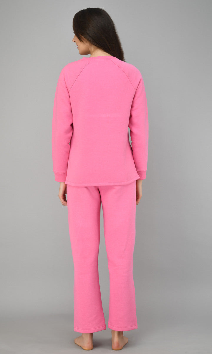 Back view of a woman wearing a Feisty Pink Fleece Sweatshirt.