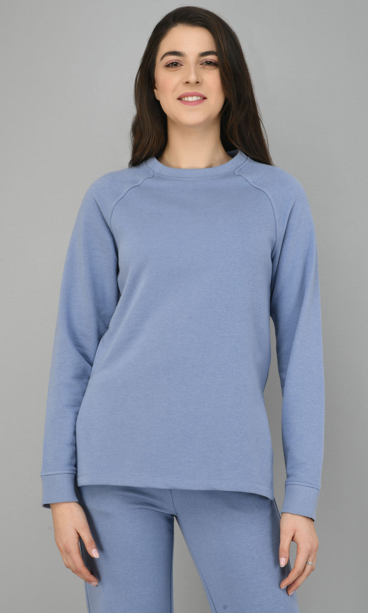 Ice-blue fleece long pullover set worn by a woman.