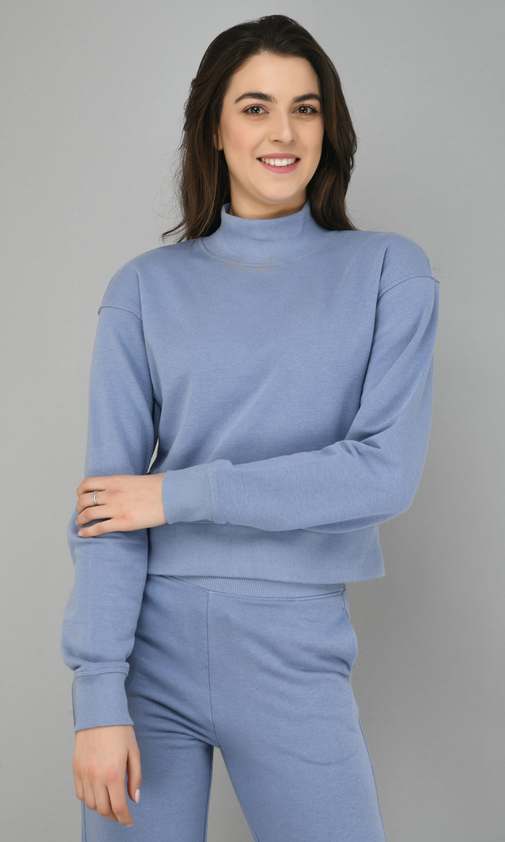 Ice-Blue fleece lounge set model smiling in cozy outfit.