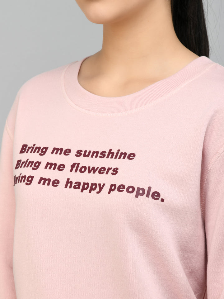 "Close-up of pink sweatshirt with cheerful text design for Ruby Red Jogger Set."