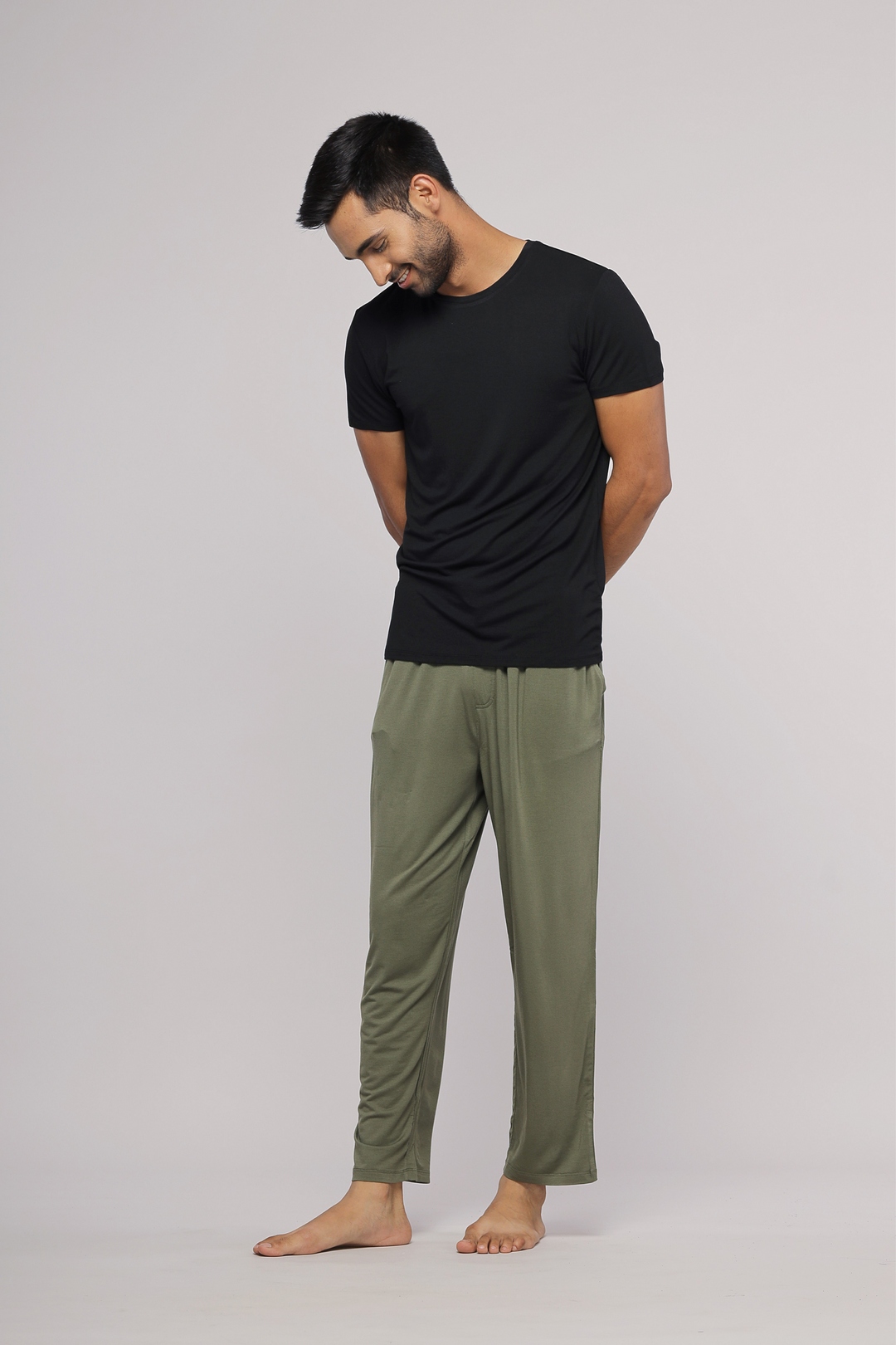 Everyday black men's t-shirt worn with olive green pants.