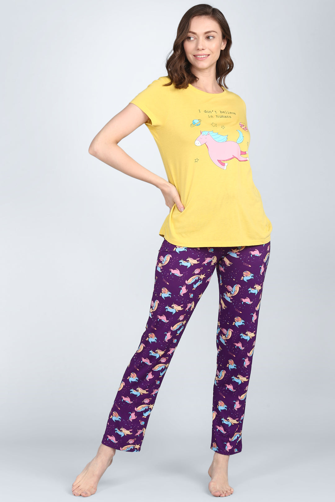 Spaced Out Unicorn Pajamas featuring playful design in yellow and purple.