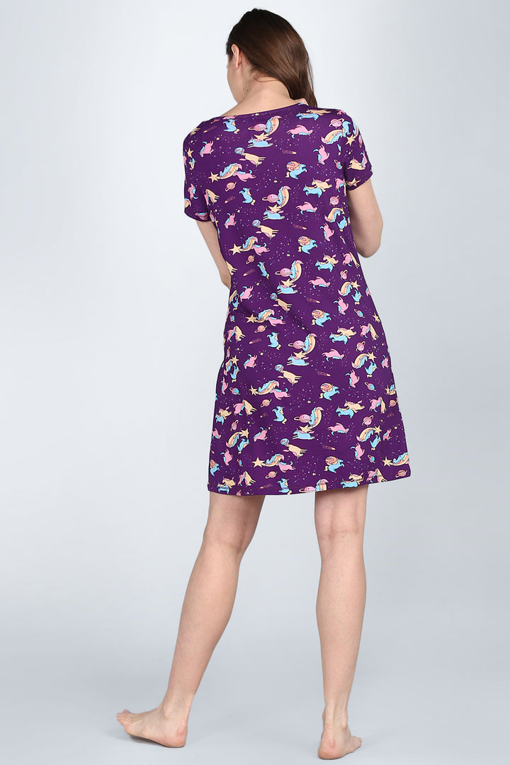 Spaced Out Unicorn Short Dress with colorful unicorn print on purple fabric.