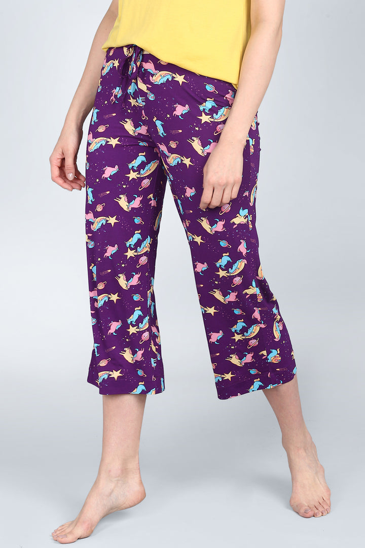 Spaced Out Unicorn Capri pants with colorful print on purple background.