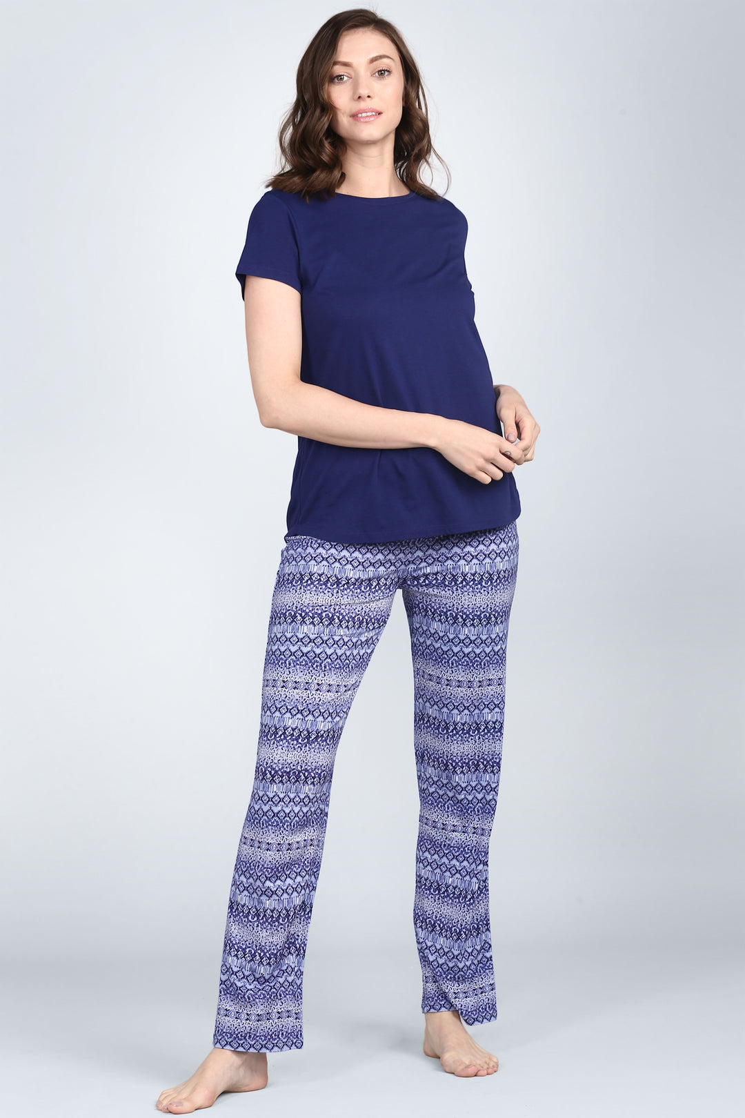 Model wearing blue tiger pajamas set with stylish patterned pants.