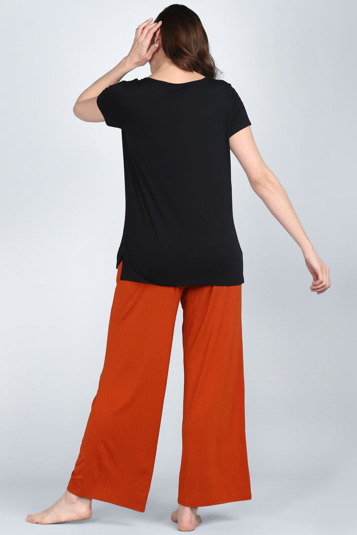 Effortless Black Lounge Set featuring a relaxed top and wide-leg pants.