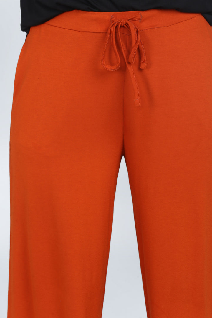 Effortless Black Lounge Set featuring relaxed fit orange pants.