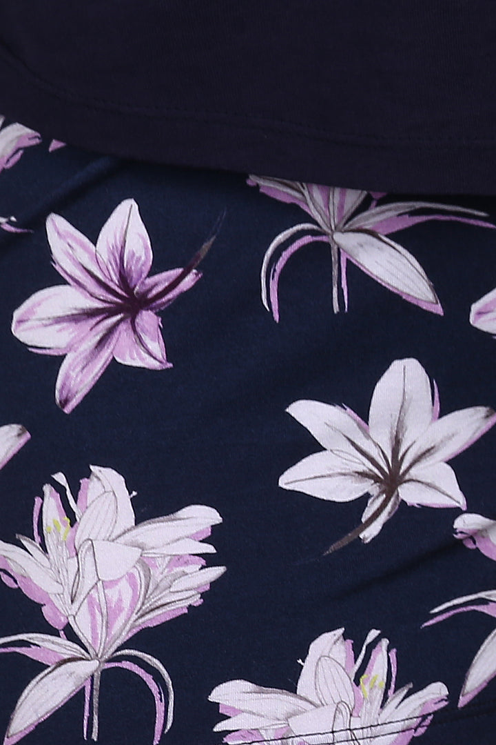 Floral pattern on Happy Blossom shorts set in navy background.