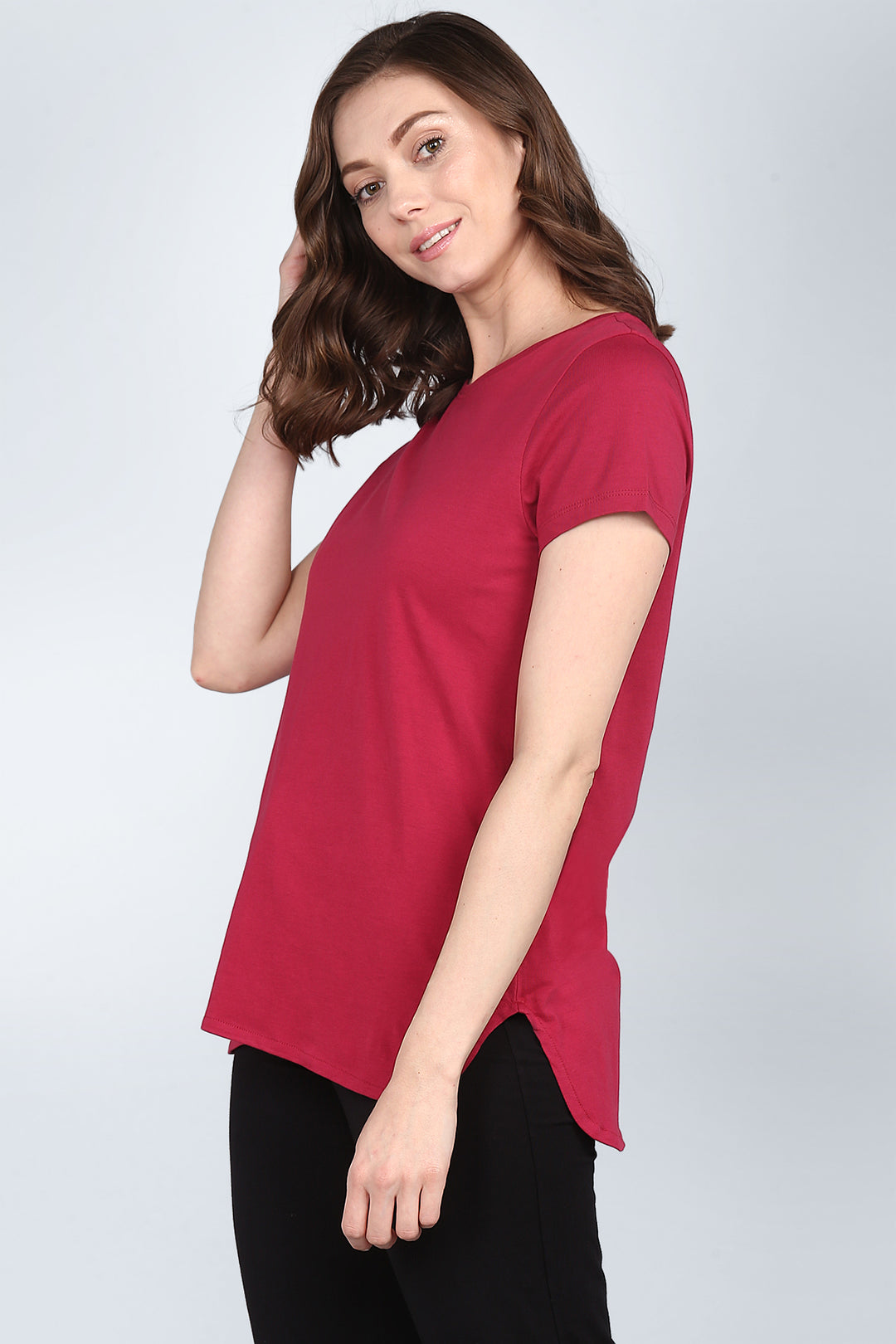 Woman modeling a red t-shirt from the Roseate Lounge Set.