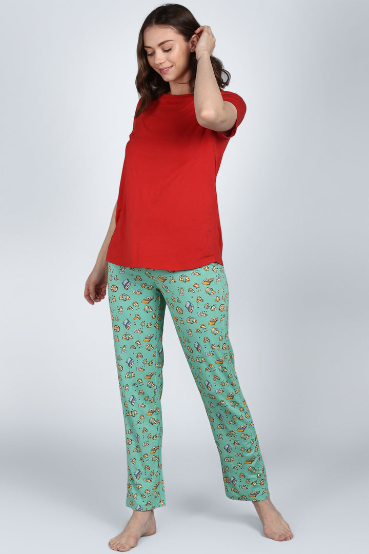 Model wearing Royal Red Pajama Set with playful patterned pants.