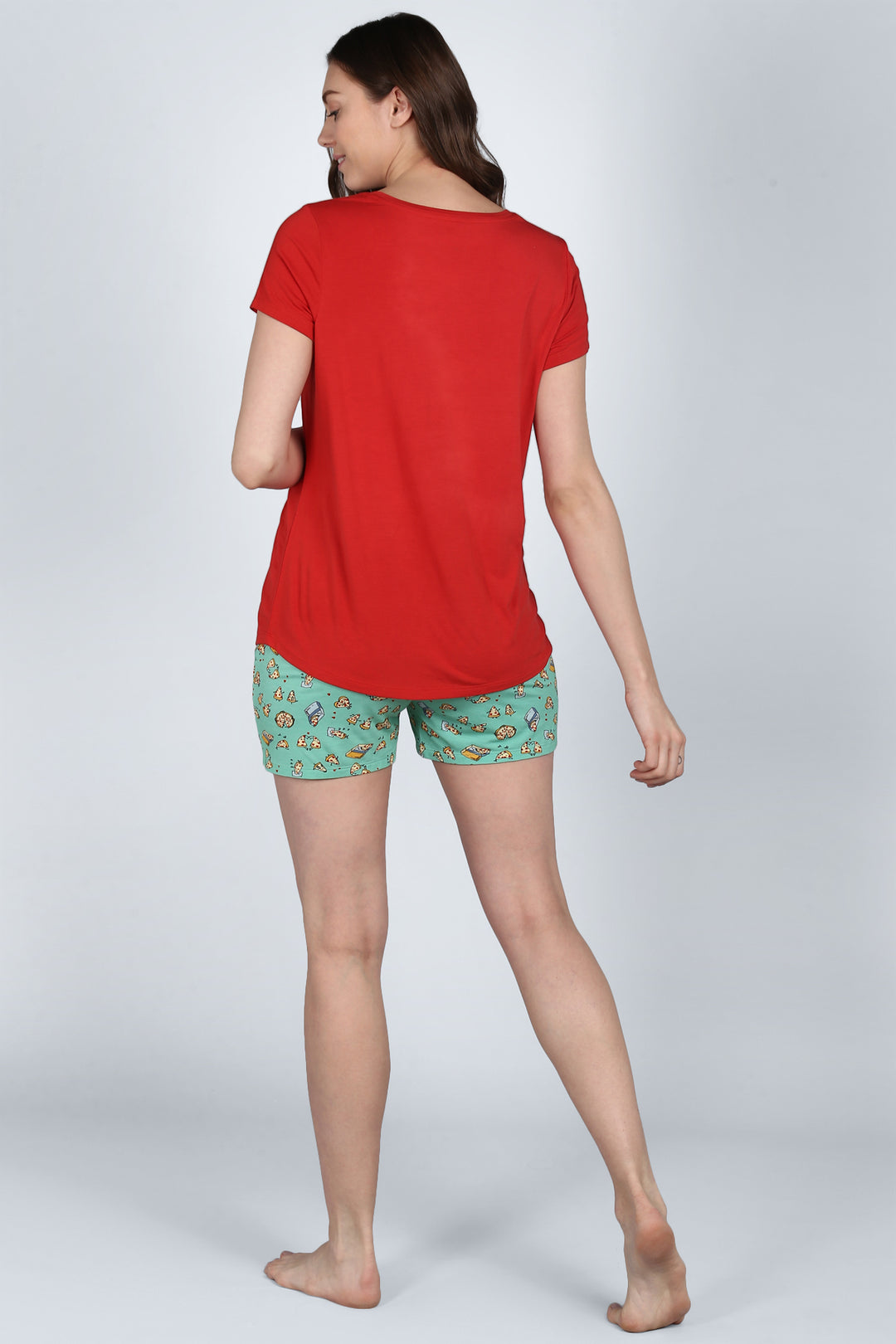 Model wearing Royal Red Shorts Set, featuring red top and quirky patterned shorts.