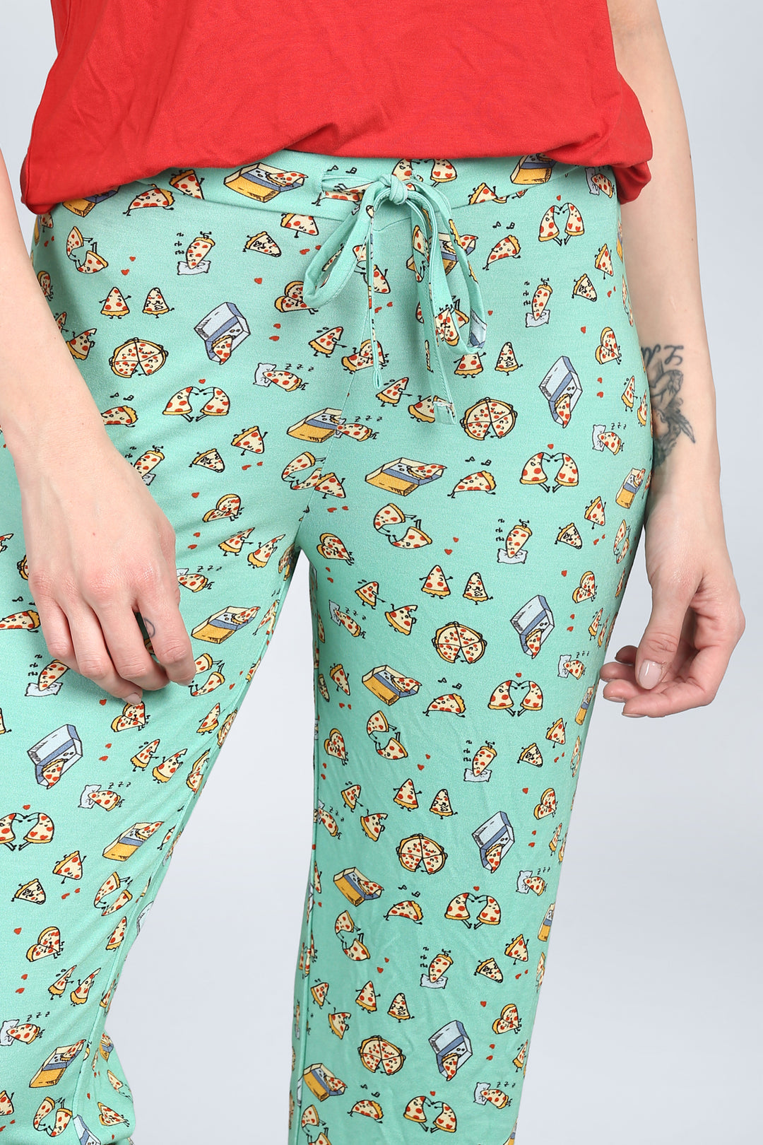 Pizza-themed Capri pants design in vibrant mint green fabric.