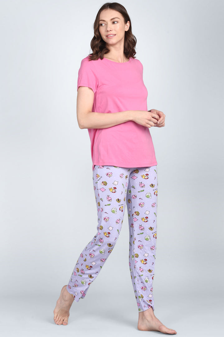 Hearty pink pajama set with colorful patterned pants for women.