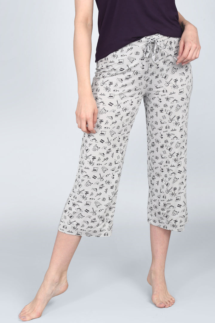 Comfortable Bon Voyage Capri pants with playful travel-themed print.