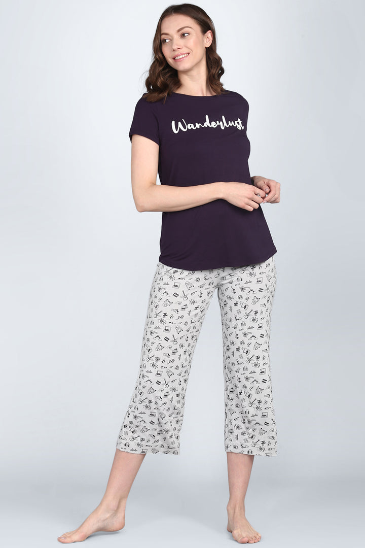 Casual women's sleepwear set featuring "Wanderlust" graphic print.