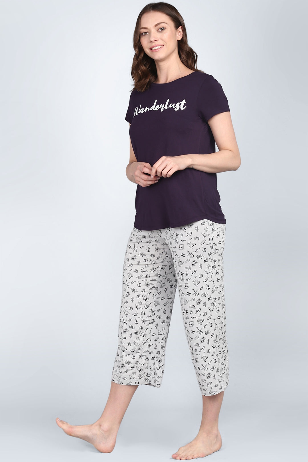 Stylish women's loungewear set featuring 'Wanderlust' graphic t-shirt.