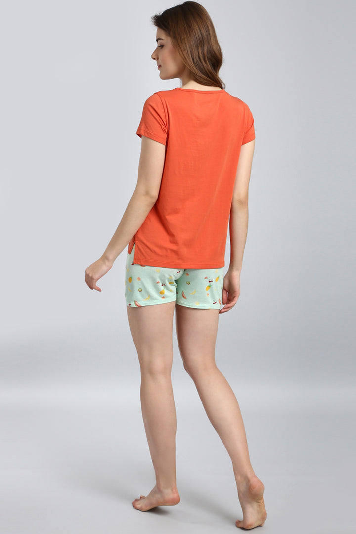 Melon Orange Top paired with playful mint fruit-print shorts.