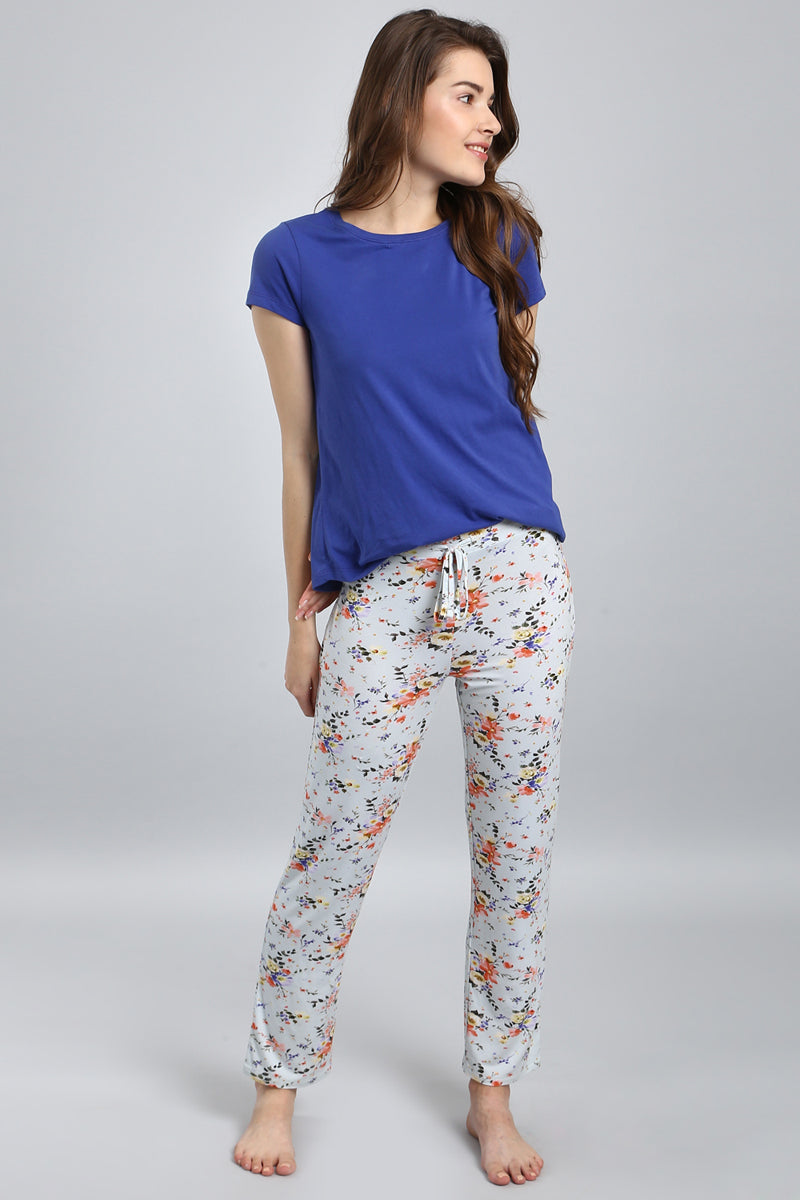 Delicate Floral Pajama Set featuring a blue top and patterned pants.