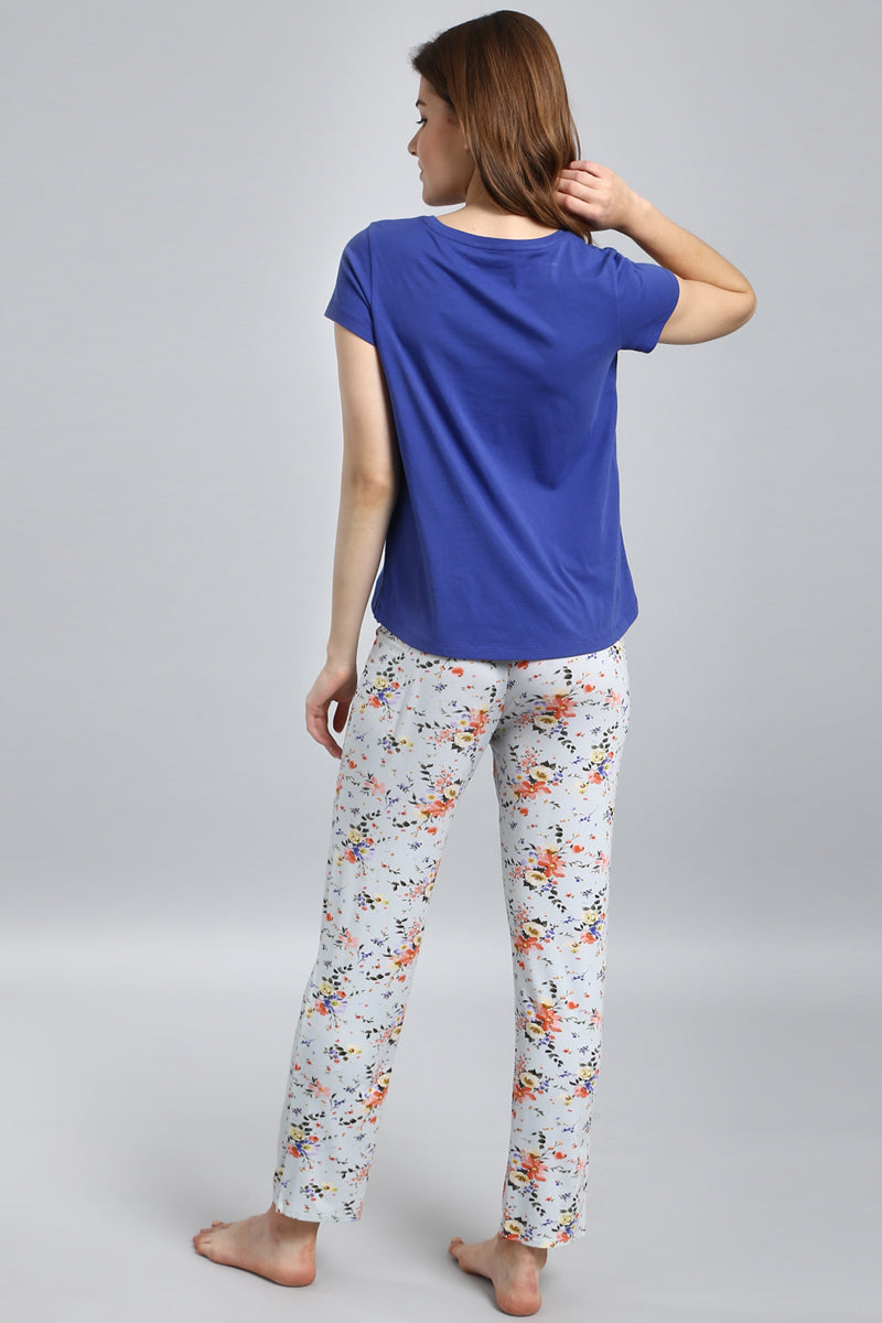 Delicate floral pajama set with blue top and patterned pants.